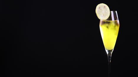 yellow cocktail with lemon