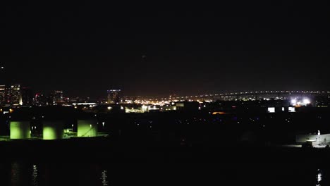 Aerial-view-of-Coronado-bridge-and-downtown-San-Diego-lit-up-at-night