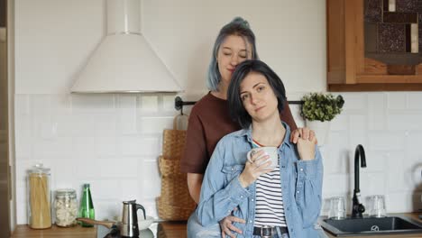 portrait video of lesbian couple in the kitchen.