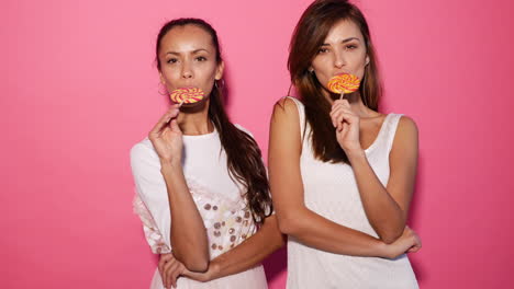 two women with lollipops