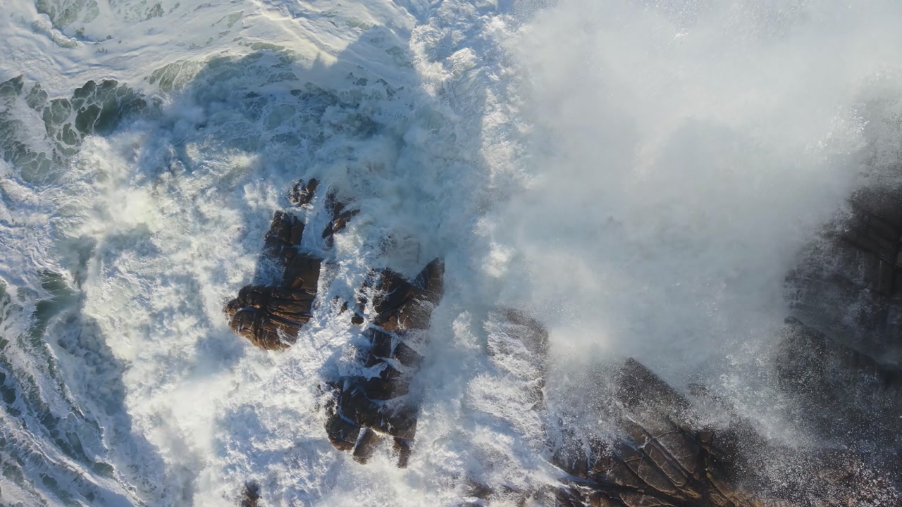 Powerful Ocean Waves Crashing Against Rocky Shoreline - Slow Motion