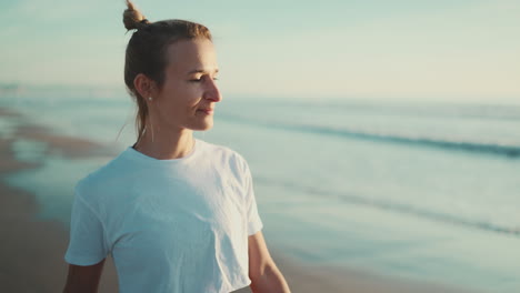 sporty girl walking and enjoying morning on the beach.