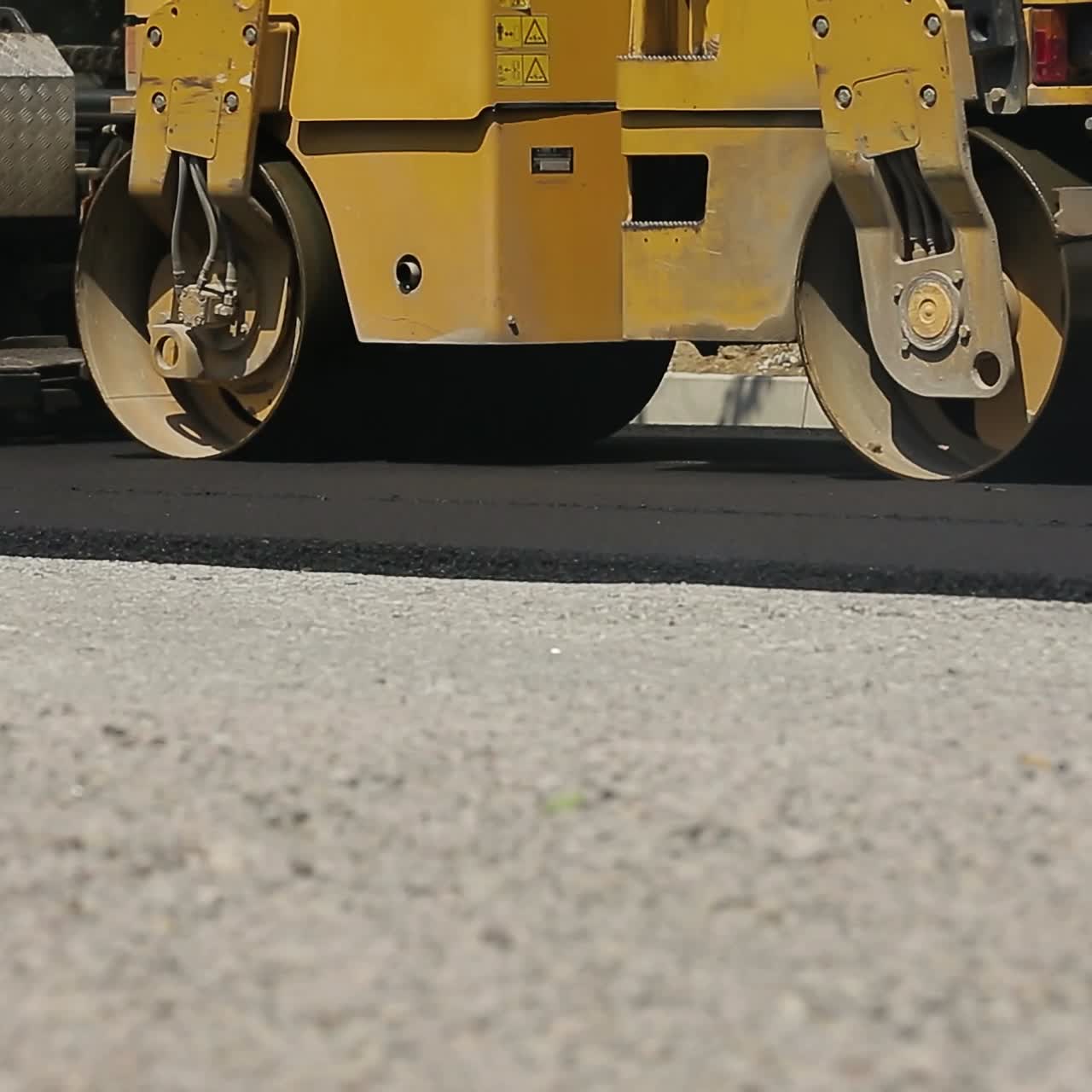 Workers Making Asphalt Road