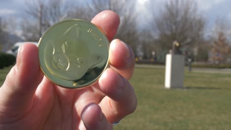 shibainu token with satoshi nakamoto statue in the background