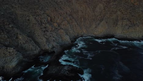 Rocks,-cliffs-and-waves-at-Punta-Lobos-in-BCS-aerial-view-after-dawn