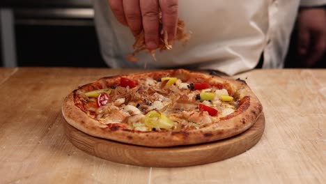 chef preparing a seafood pizza