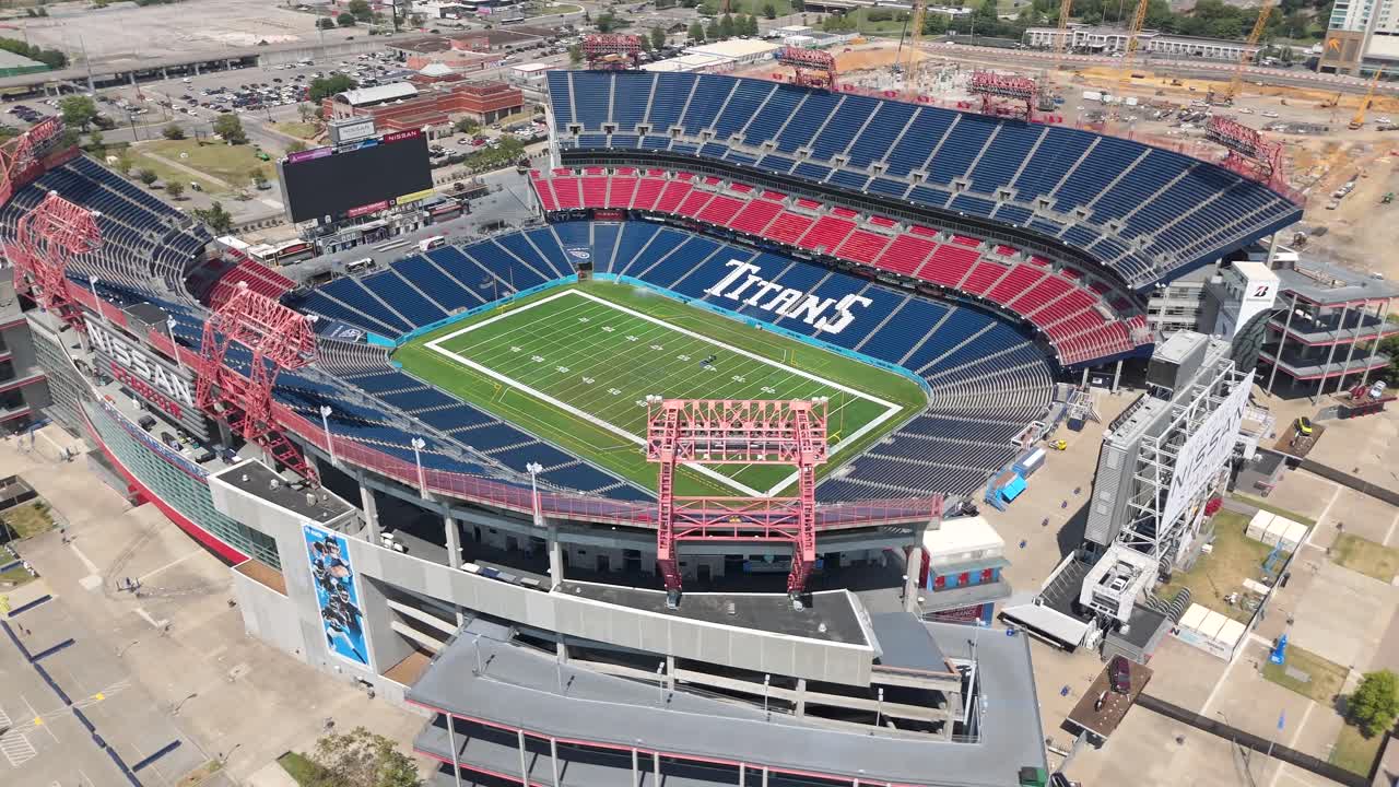 Nissan Stadium in Nashville, Tennessee is the home field of the Tennessee Titans National Football League team - aerial orbit