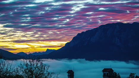 Colorful-cloudscape-time-lapse-at-sunset-over-Attersee-Lake,-Austria