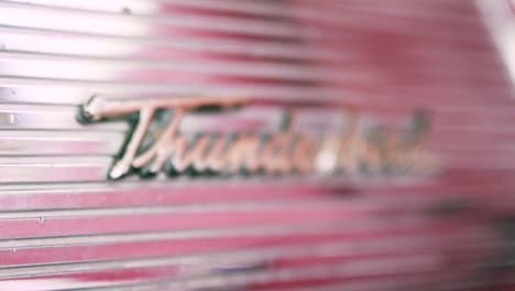 close-up of a vintage ford thunderbird emblem