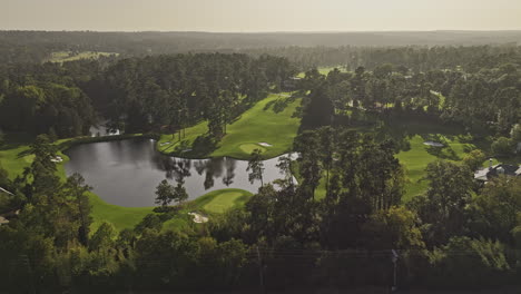 augusta georgia aerial v59 cinematic drone flyover around the national golf course, capturing sunset views of the lush fairways, lake, and cityscape - shot with mavic 3 pro cine - october 2023