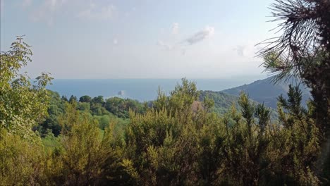 big ship is leaving harbour from genoa italy, view from mountains