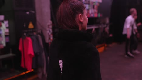 woman in a clothing store at night