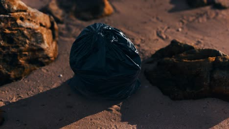 black-plastic-garbage-bags-full-of-trash-on-the-beach