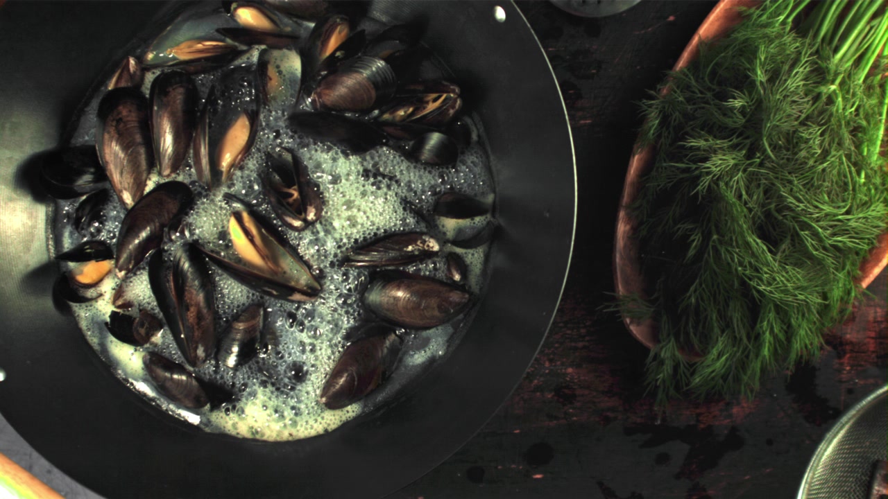 Fresh Mussels Steaming in a Pan with Dill