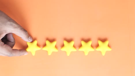 hand placing a star rating