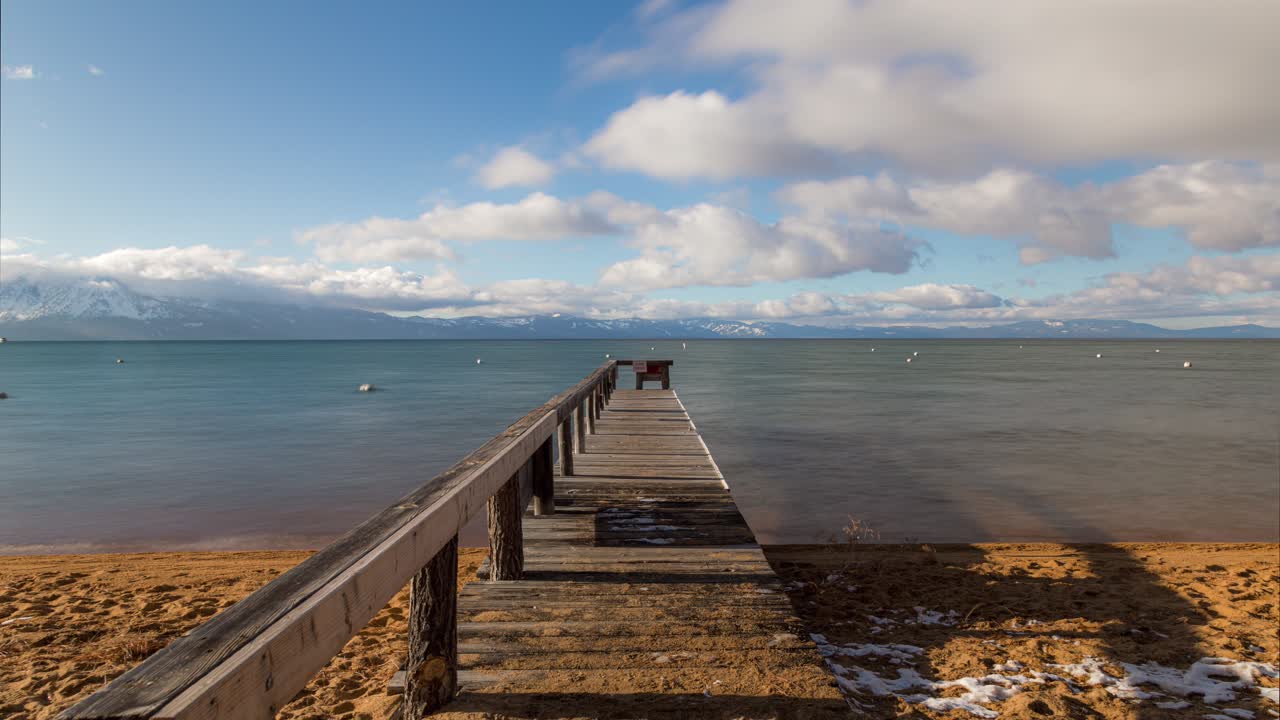 Peaceful Water Of Lake Tahoe From Wooden Dock In Daytime