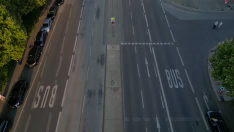 berlin cityscape with residential buildings, a coca cola billboard, and cars moving along the streets. magic aerial view flight tilt up drone