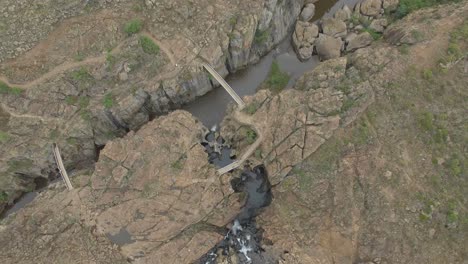straight down aerial view of bourkes luck potholes canyon and river in south africa