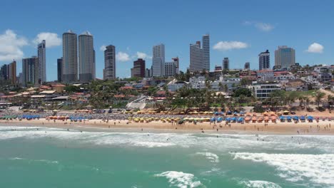 pullback from beach with ponta preta skyline, touristic destination, brazil