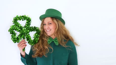 Woman-being-Sad-to-Happy-showing-Shamrock-celebrate-St-Patricks-Day,-Studio-Static