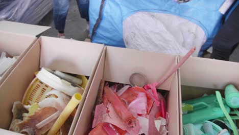 boxes of plastic waste particles sorted by color