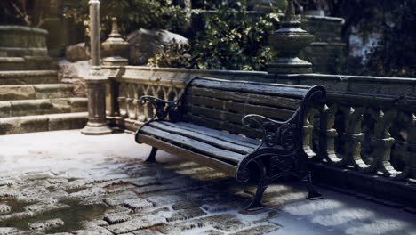 snow covered bench in a quiet park during winter afternoon