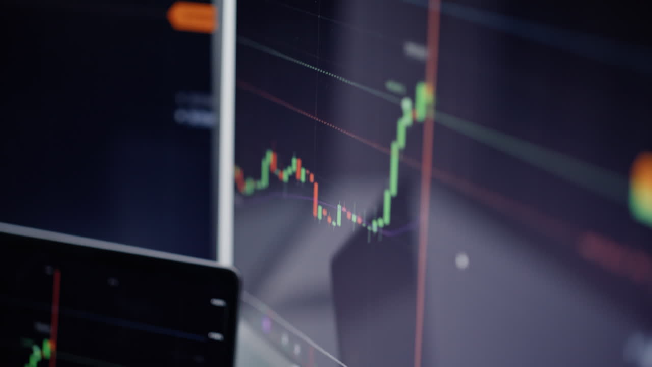 Electronic finance screens display blockchain asset data in workspace closeup