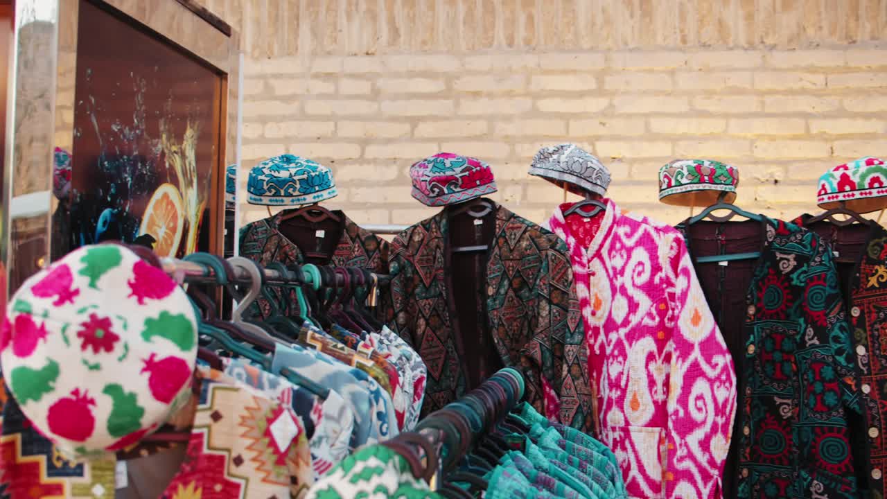 Khiva Uzbekistan Fortress Ichan Kala bright clothes oriental style. Street vendors in Khiva 1