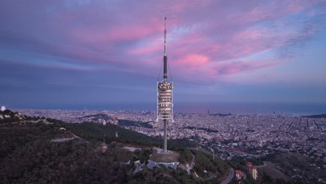 torre de collserola tower with barcelona cityscape in background, spain, aerial