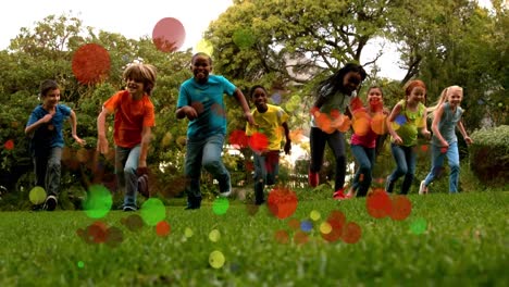 school kids running in slow motion towards the camera in a park