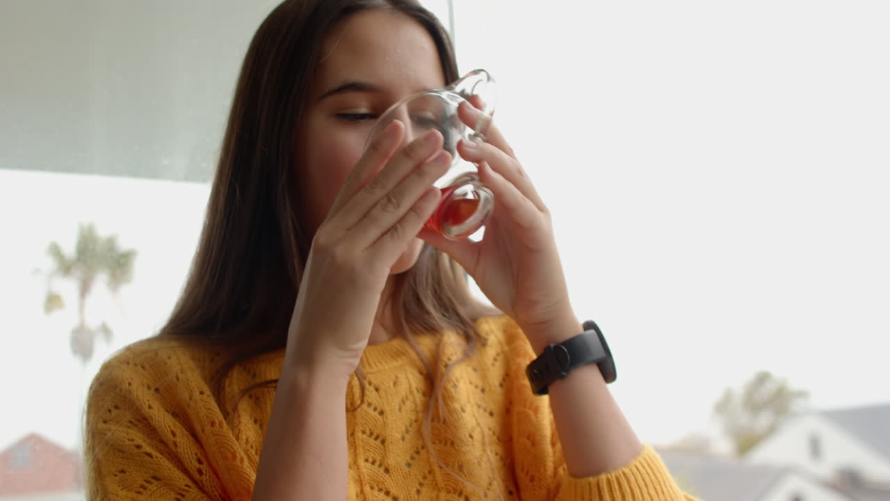 Relaxing at home, woman enjoying spa treatment and unwinding in yellow sweater
