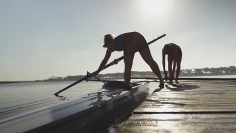 female rowers training on a river