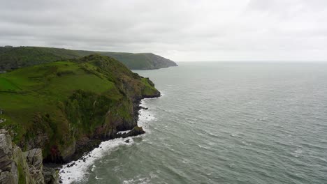 Waves-lap-the-cliffs-on-the-north-Devon-coast-from-the-Valley-of-the-Rocks-in-Exmoor-National-Park-near-Lynton-and-Lynmouth