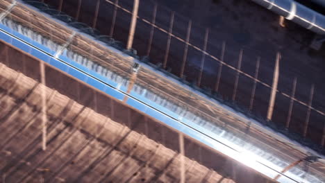 "a close-up view of solar panels at the noor solar energy complex in morocco, showcasing advanced technology converting intense sunlight into sustainable and eco-friendly electricity."