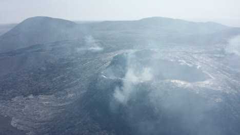 Panoramic-view-of-smoking-volcanic-landscape-after-eruption.-Solid-lava-streams-on-hill-slopes.-Fagradalsfjall-volcano.-Iceland,-2021