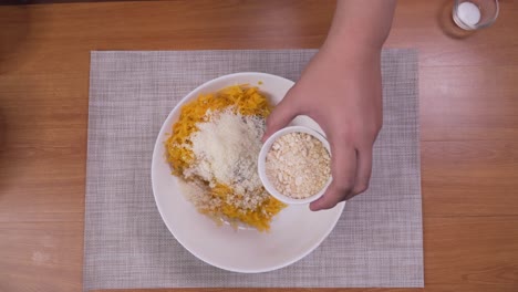 mixing ingredients and spices for vegetable pancakes, time lapse