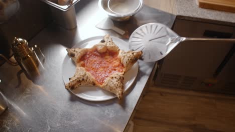 star-shaped pizza being prepared