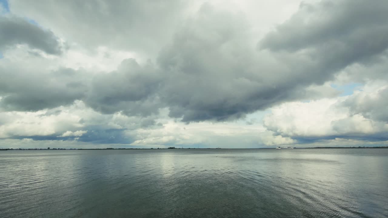Storm clouds over the calm water