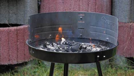 Burning-Charcoal-On-Barbecue-Grill-At-The-Park-In-Styporc,-Northern-Poland