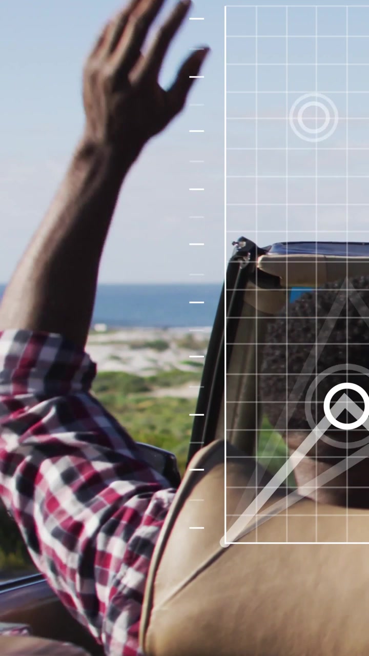 Vertical video: Passenger leaning out as convertible driving coastal road auto HUD tracking arm