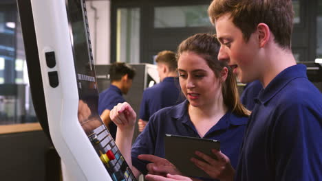 engineering apprentices learn how to use cnc tool making machine