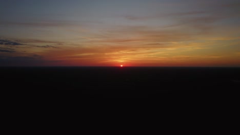 aerial view of the sun setting over mexico's tropical beaches