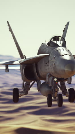 un avión de combate f-18 super hornet volando sobre un desierto