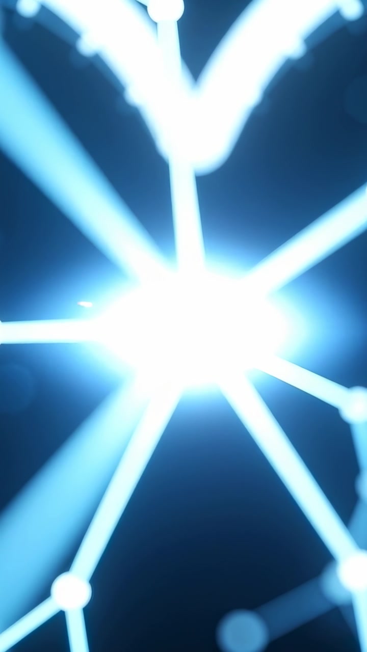 Vertical video: Brightening central node pulsing radial beams in black void, emitting orange sparks