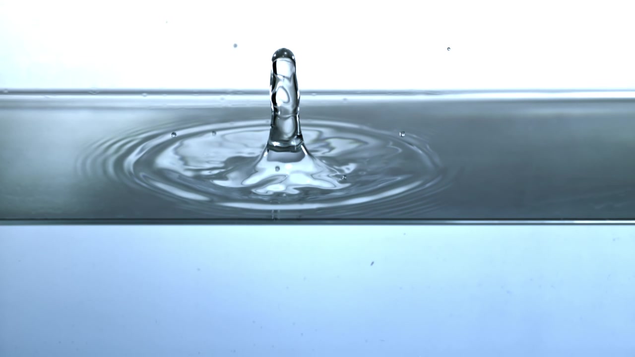 Water Droplet Falling and Creating a Splash in Slow Motion