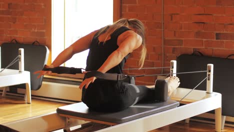 Woman-exercising-on-gym-equipment