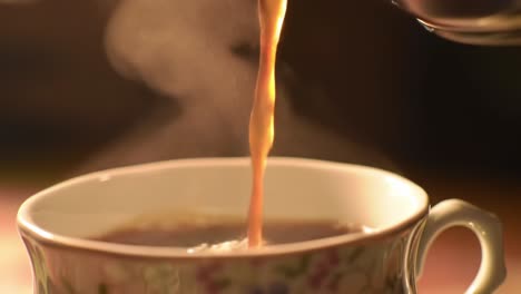 a serene moment of tea being poured into a delicate cup, capturing the essence of relaxation and comfort through aromatic steam and rich flavor