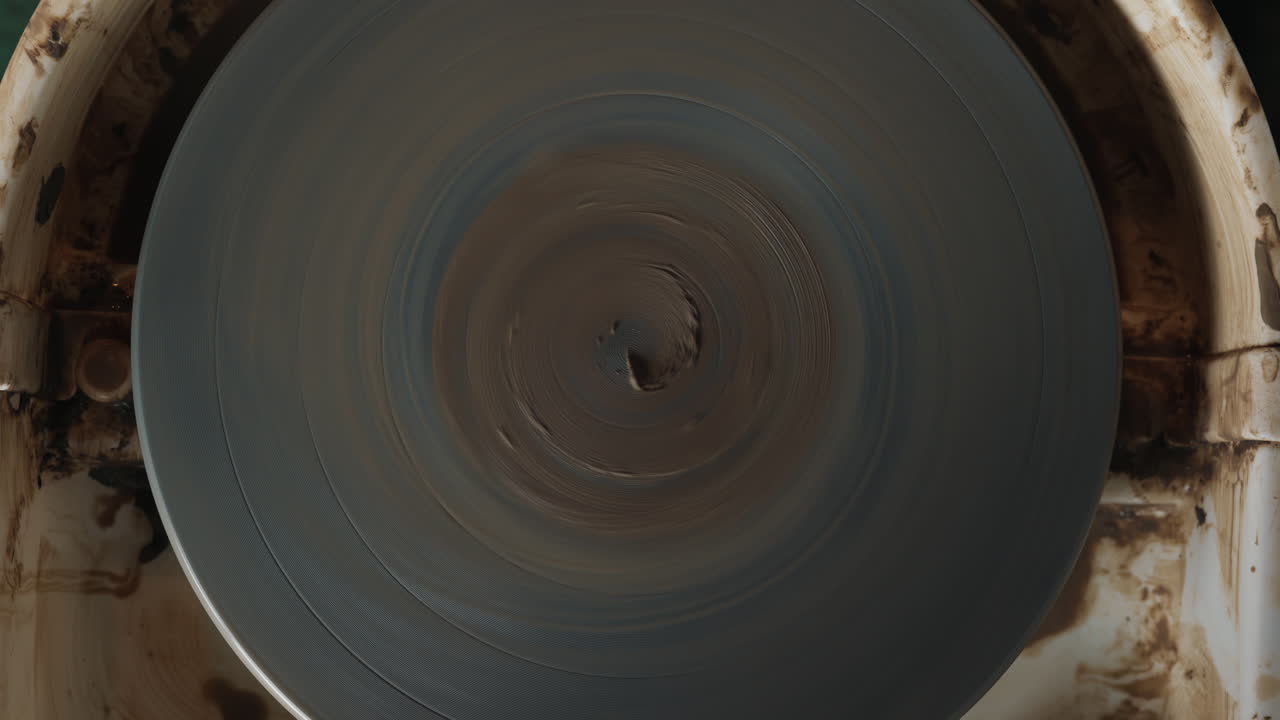 Rotating Potters Wheel with Clay