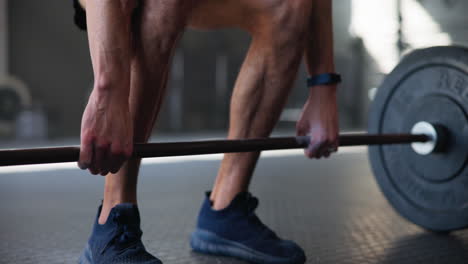 man lifting weights at the gym