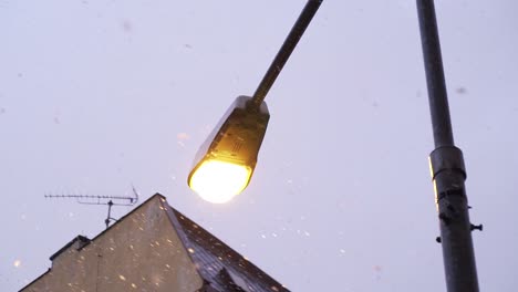 Close-up-of-street-lamp-in-a-snow-in-slow-motion